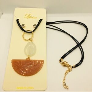 NECKLACE SHELL LIKE IN BURNT ORANGE ON CORD!